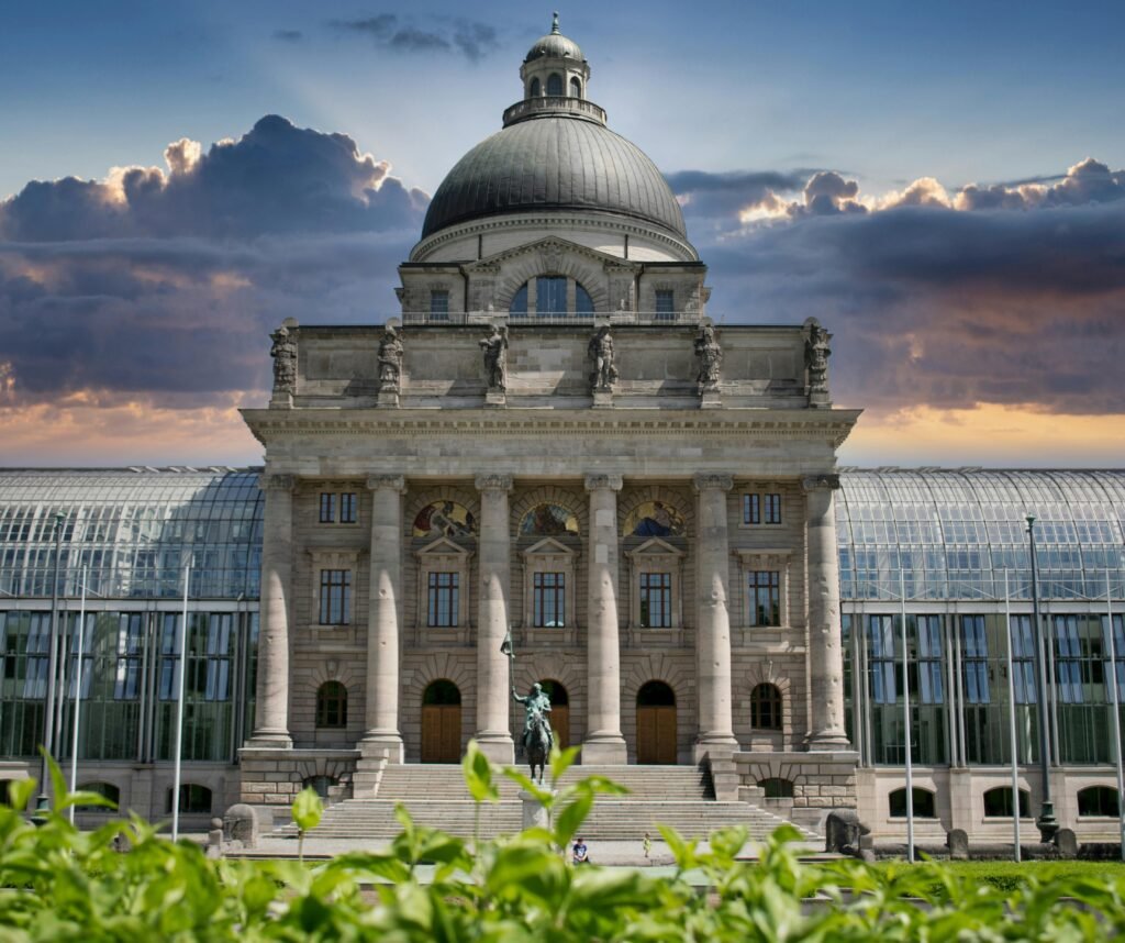 The Bavarian State Chancellery, Munich, at sunset showcasing its Renaissance architecture and dome.